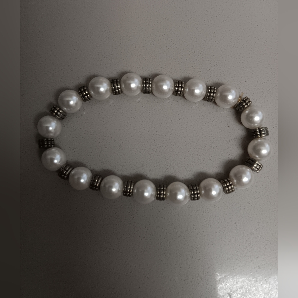 Pearl and sterling silver beads strung on elastic